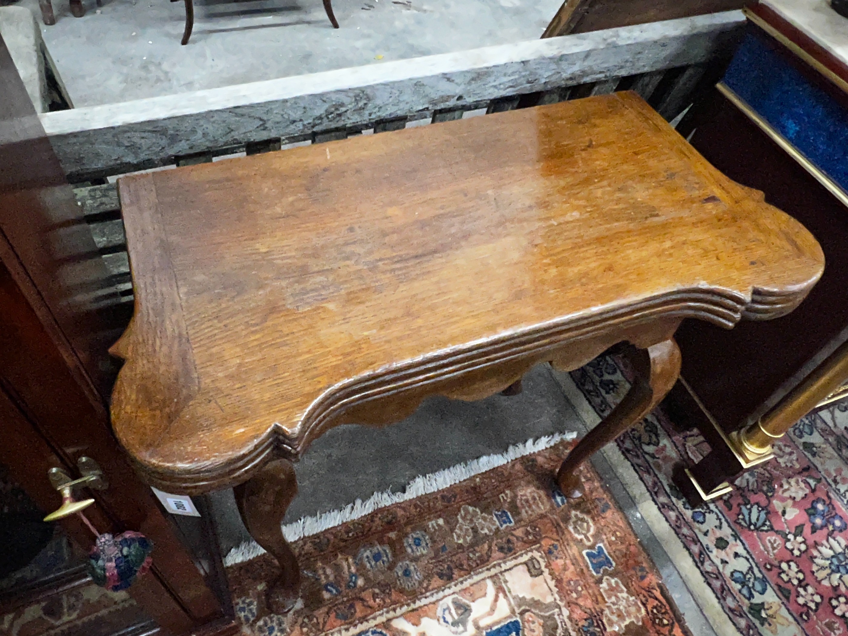 An 18th century style oak folding card table, width 82cm, depth 40cm, height 76cm